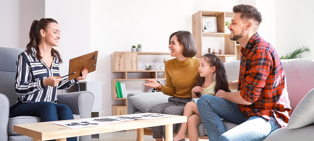 Family visiting psychologist in office